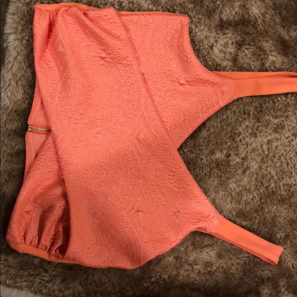 Orange Bebe crop top.